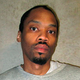 This photo provided by the Oklahoma Department of Corrections shows Julius Jones Feb. 5, 2018, file. Oklahoma Gov. Kevin Stitt has agreed to commute the death sentence of condemned inmate Julius Jones, who was convicted of murder for a 1999 killing. Stitt announced his decision on Thursday, Nov. 18, 2021, the day of Jones’ scheduled execution. (Oklahoma Department of Corrections via AP, File)
